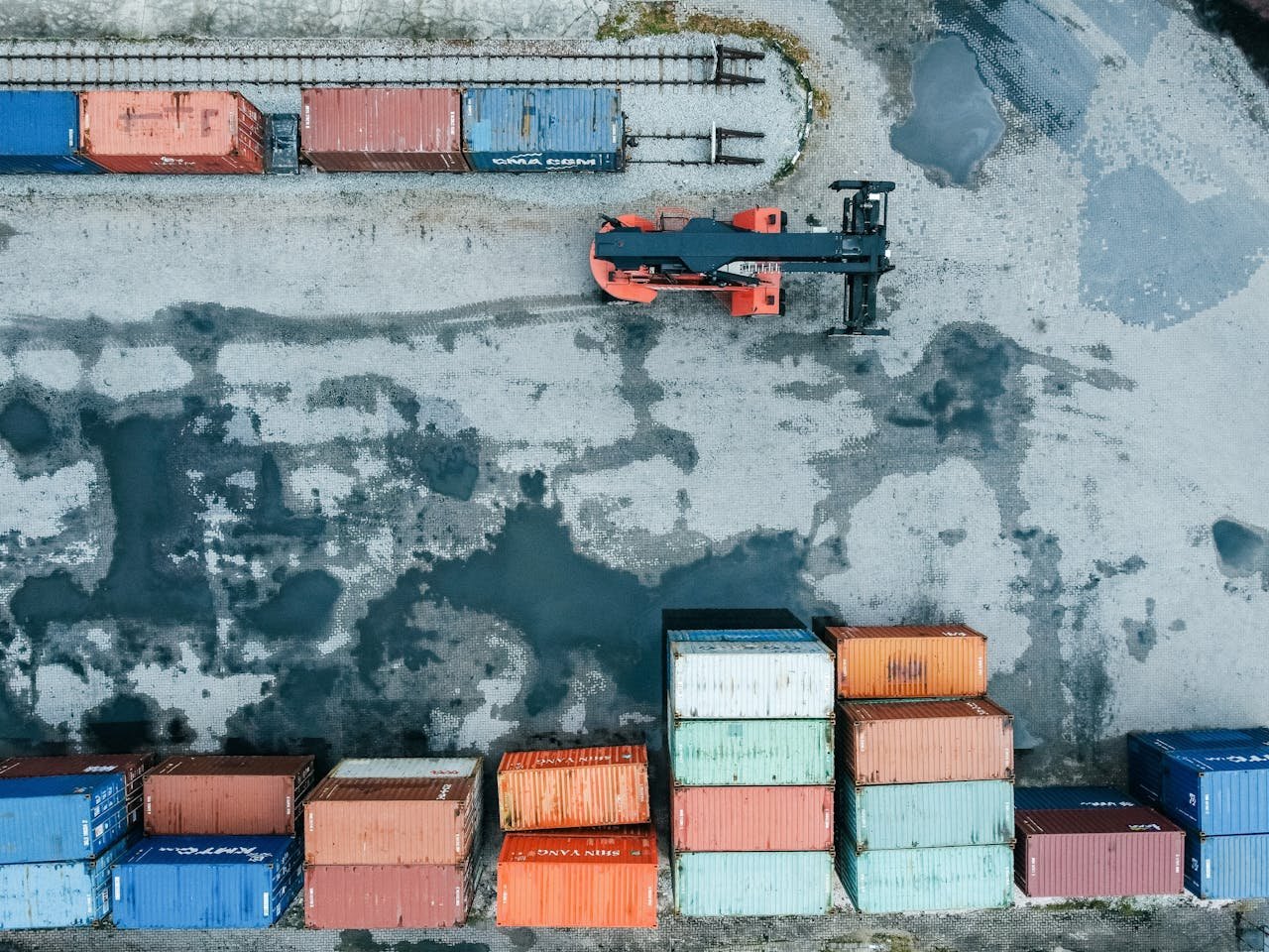 Aerial shot of stacked shipping containers in Ipoh, Malaysia port.